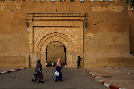 North Africa. Morocco. Taroudant. Two women in a chador in front of the Bab Sedra gate of the city wallsのeditorial素材