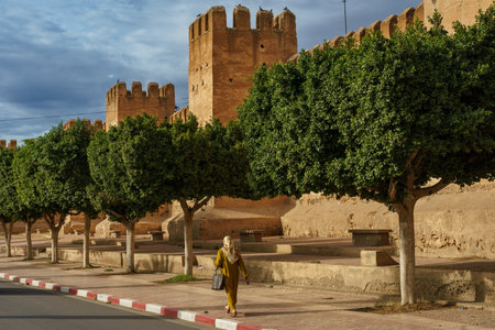 North Africa. Morocco. Taroudant. A woman walking in front of the city wallsのeditorial素材