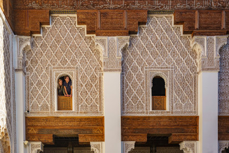 North Africa. Morocco. Marrakesh. Tourists at the windows of the Medersa Ben Youssef. The largest and most important madrassa in Moroccoのeditorial素材