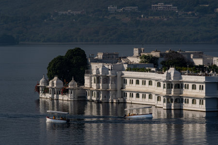India. Rajasthan. Udaipur. The Taj Lake Palace set in the middle of Lake Pichola in the early morning lightの写真素材