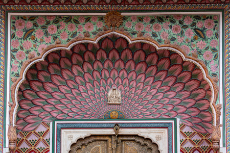 India. Rajasthan. Jaipur. City Palace. Architecture detail of the Lotus Gate with floral motifs, it represents summer and is dedicated to the god Shiva and the goddess Parvati. One of the four gates known as Ridhi Sidhi Pol in the inner courtyard of the Chandra Mahalの写真素材