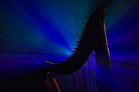Electro harp in the rays of lightの写真素材