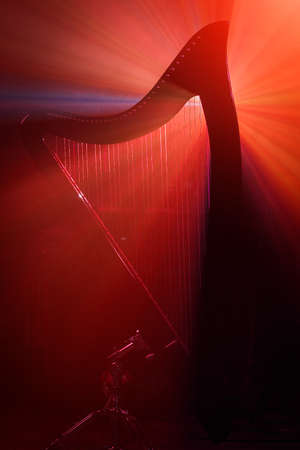 Electro harp in the rays of lightの写真素材