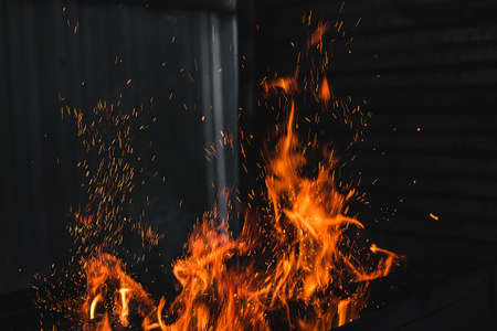 Fire burning on the grillの写真素材