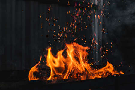 Fire burning on the grillの写真素材