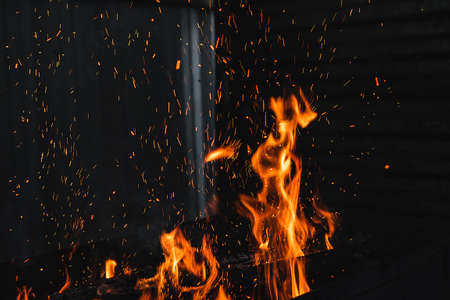 Fire burning on the grillの写真素材