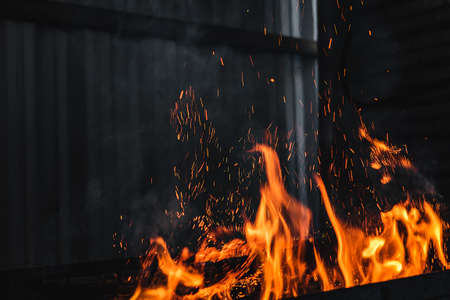 Fire burning on the grillの写真素材