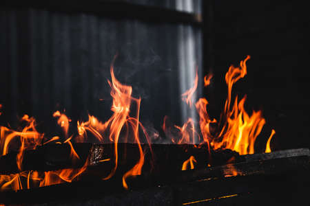 Fire burning on the grillの写真素材