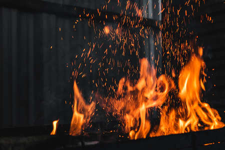 Fire burning on the grillの写真素材