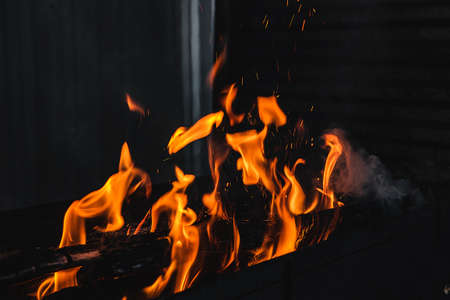 Fire burning on the grillの写真素材