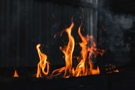 Fire burning on the grillの写真素材