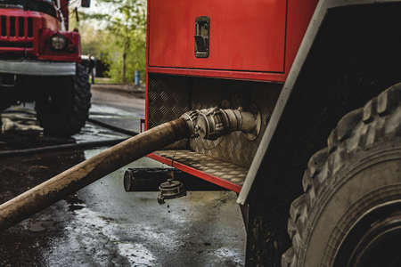 Firefighters extinguished the fire at an old house caught fireの写真素材