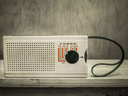 Vintage radio on wall background
