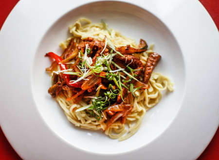 Tasty pasta with mushrooms and sauceの写真素材