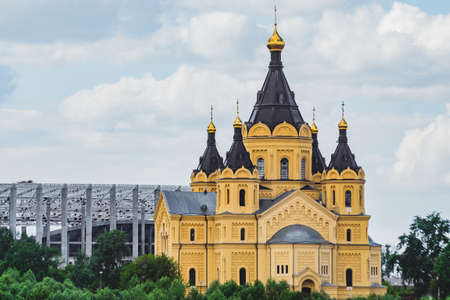 The big yellow temple in Russia on the river bankの写真素材