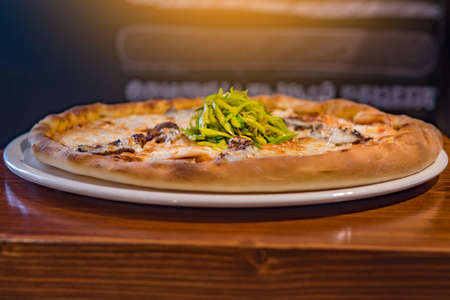 Very tasty pizza in a cafe restaurantの写真素材