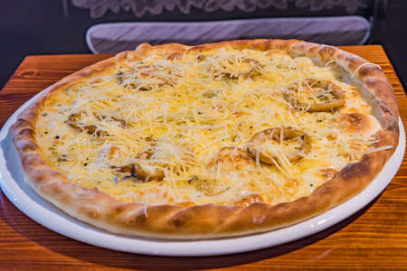 Very tasty pizza in a cafe restaurantの写真素材
