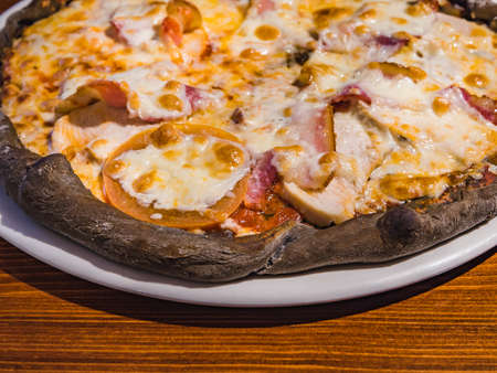 Very tasty pizza in a cafe restaurantの写真素材