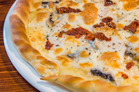 Very tasty pizza in a cafe restaurantの写真素材