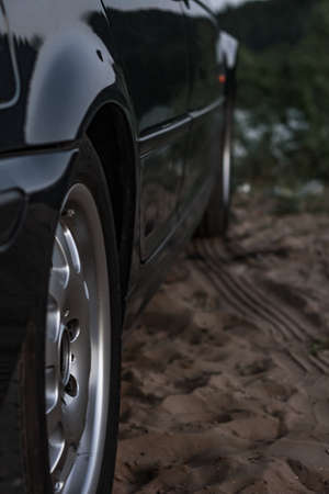 Sports car side view, alloy wheels