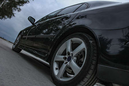 Sports car side view, alloy wheelsの写真素材