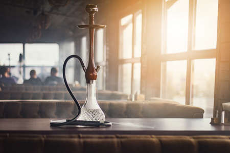 Stylish hookah made of glass and woodの写真素材