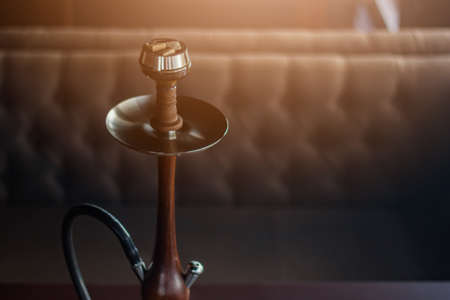 Stylish hookah made of glass and woodの写真素材