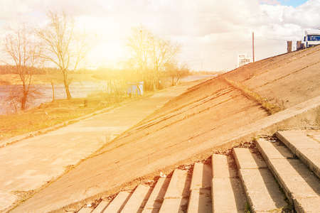 Stairs on the embankment, sunny dayの写真素材