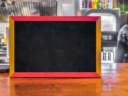 Chalkboard in a cafe, for inscriptions and designの写真素材