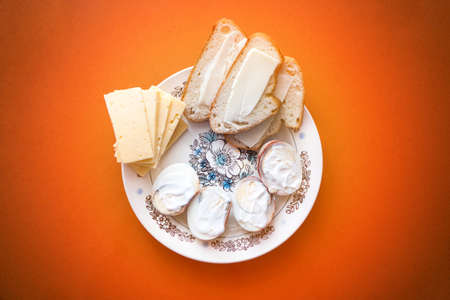 Delicious homemade breakfast with eggs, cheese and breadの写真素材