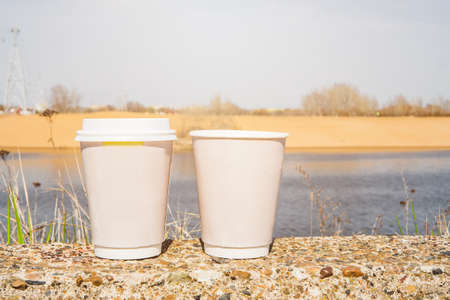 Two paper cups left on the streetの写真素材