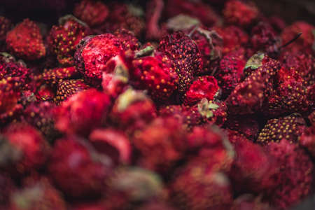 A lot of dried strawberries on the counter in the storeの写真素材