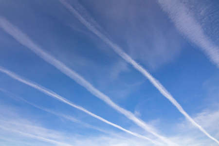 Beautiful sky, clouds and stripes from flying planesの写真素材