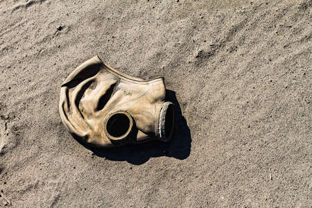 Old gas mask, lying on the groundの写真素材