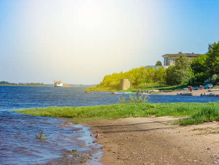 River embankment in a small town, summer dayの写真素材