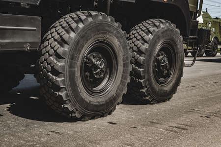 The wheel of a fighting vehicle standing in the park