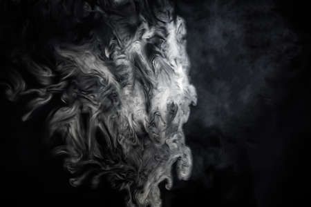 White smoke on a black background, for designの写真素材