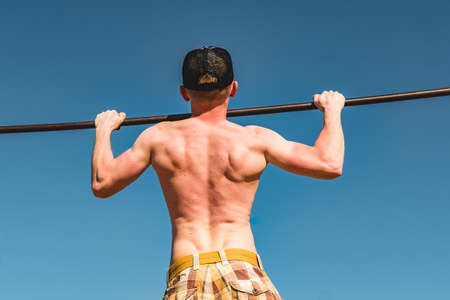 athlete on a bar sunny summer dayの写真素材