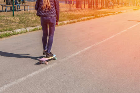 A guy with a skateboard on a sunny summer dayの写真素材