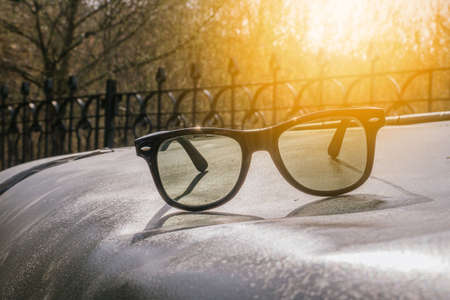 Sunglasses in an old military car, spring dayの写真素材