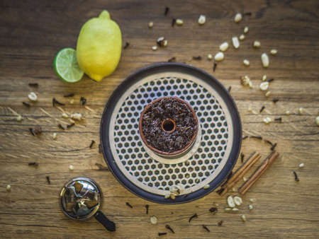 Clay bowl for a hookah, beautiful serve in a cafeの写真素材