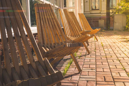 Beautiful wooden chairs on the street near the cafeの写真素材