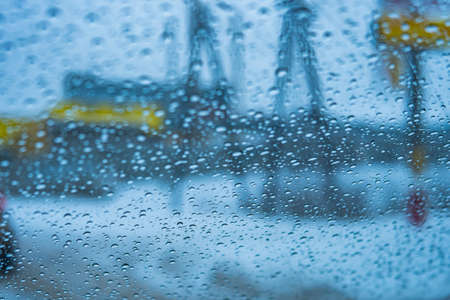 Texture of glass with drops of water on a rainy autumn dayの写真素材
