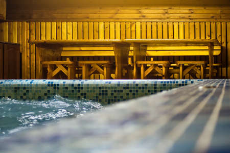 Pool in a small sauna with clear blue water. Pleasant place to stayの写真素材