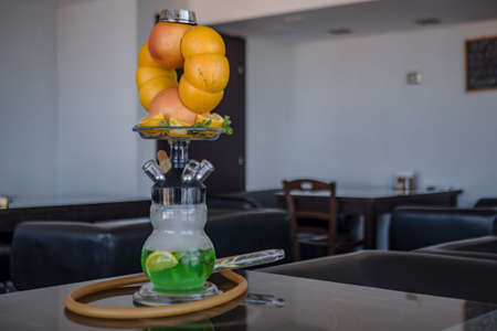 Beautiful glass hookah, with a fruit bowl, consisting of oranges and grapefruit. Handmade in a flask...