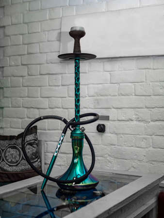 New hookah on a table in an oriental cafe. A variety of flavors of tobacco.の写真素材