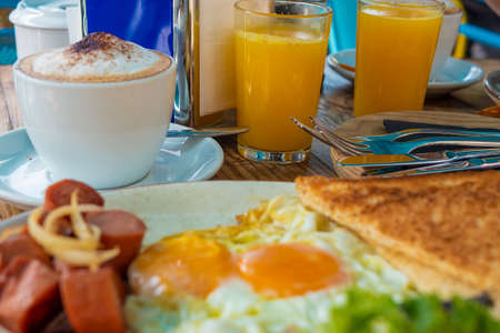 Tasty breakfast in the early morning in a summer cafe. Sunny bright light. Juneの写真素材