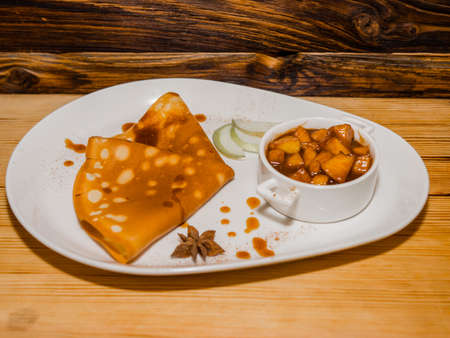 Delicious hot pancakes with various fillings on the table.の写真素材