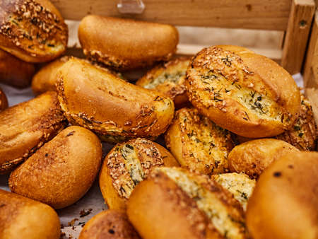 Freshly baked bread on trays in a self-catering supermarket.の写真素材