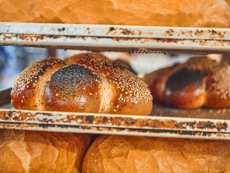 Freshly baked bread on trays in a self-catering supermarket.の写真素材